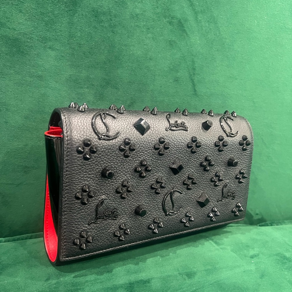 I am selling this beautiful black and red Louboutin Purse.